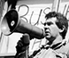 Photograph of speakers at a demonstration. Photograph of speakers at a demonstration.