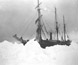 An early Antarctic exploration vessel surrounded by snow. An early Antarctic exploration vessel surrounded by snow.