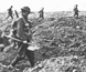 Photograph of Australian troops crossing trenches. Photograph of Australian troops crossing trenches.