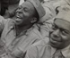 Photograph of American soldiers watching a comedy show. Photograph of American soldiers watching a comedy show.